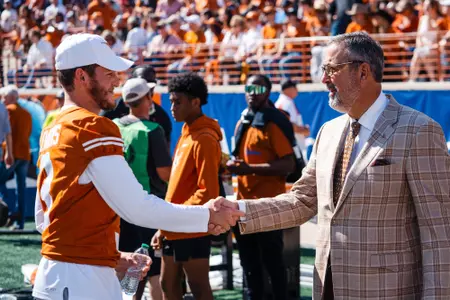 Quinn Ewers and Athletic Director Chris Del Conte