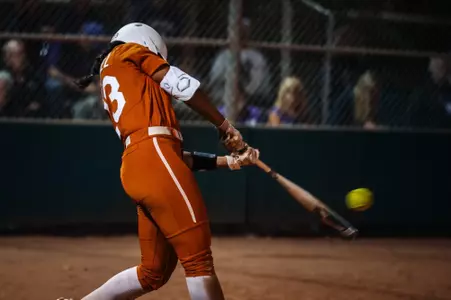 Viviana Martinez drives a pitch towards the outfield for a run-scoring hit.