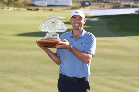 SCOTTSDALE, ARIZONA - FEBRUARY 12: Scottie Scheffler of the United States celebrates with the trophy after winning during the final round of the WM Phoenix Open at TPC Scottsdale on February 12, 2023 in Scottsdale, Arizona. (Photo by Maddie Meyer/Getty Images)