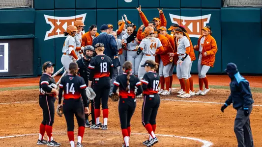 Katie Cimusz celebrates a homer with her teammates during Saturday's win over Omaha.