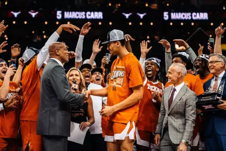 Dylan Disu is presented with the Most Outstanding Player honor