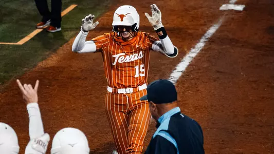 Courtney Day celebrates a homer vs. Louisiana