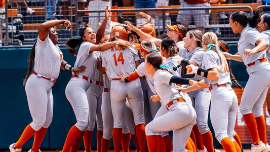 Reese Atwood celebrates her walk-off homer in Saturday's opening game against Oklahoma State
