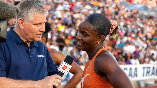 Julien Alfred is interviewed following her victory in the 200 meter