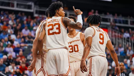 player huddle on court during big 12 tourney 2024