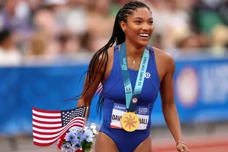 EUGENE, OREGON - JUNE 29: Tara Davis-Woodhall reacts with the gold medal after winning the women's long jump final on Day Nine of the 2024 U.S. Olympic Team Track & Field Trials at Hayward Field on June 29, 2024 in Eugene, Oregon. (Photo by Patrick Smith/Getty Images)