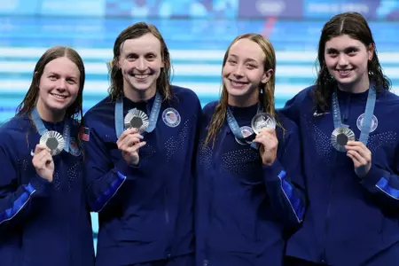 NANTERRE, FRANCE - AUGUST 01: Silver Medalists (left to right): Erin Gemmell, Katie Ledecky, Paige Madden and Claire Weinstein of Team United States pose following the Swimming medal ceremony after the Women's 4x200m Freestyle Relay Final on day six of the Olympic Games Paris 2024 at Paris La Defense Arena on August 01, 2024 in Nanterre, France. (Photo by Clive Rose/Getty Images)