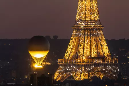 PARIS, FRANCE - AUGUST 10: Olympic cauldron as it rises high near Eiffel tower on day fifteen of the Olympic Games Paris 2024 at on August 10, 2024 in Paris, France. (Photo by Maja Hitij/Getty Images)