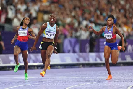 PARIS, FRANCE - AUGUST 03: Julien Alfred of Team Saint Lucia celebrates winning the gold medal during the Women's 100m Final on day eight of the Olympic Games Paris 2024 at Stade de France on August 03, 2024 in Paris, France. (Photo by Cameron Spencer/Getty Images)