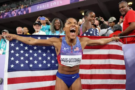 PARIS, FRANCE - AUGUST 08: Tara Davis-Woodhall of Team United States celebrates winning the gold medal after competing in the Women's Long Jump Final on day thirteen of the Olympic Games Paris 2024 at Stade de France on August 08, 2024 in Paris, France. (Photo by Patrick Smith/Getty Images)