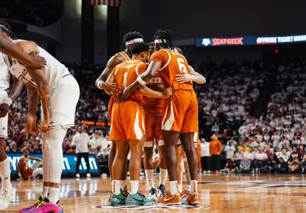 player huddle on court at Texas A&M