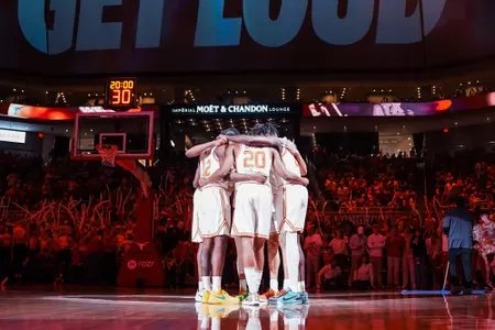 Men's Basketball pre-game player huddle