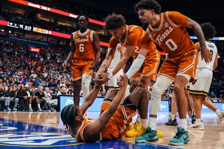 mbb players picking up Tramon Mark