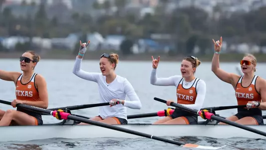 The Texas I Eight celebrates following winning its first heat at the San Diego Crew Classic on Saturday