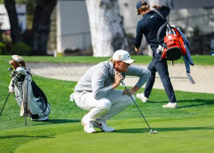 Tommy Morrison lining up putt