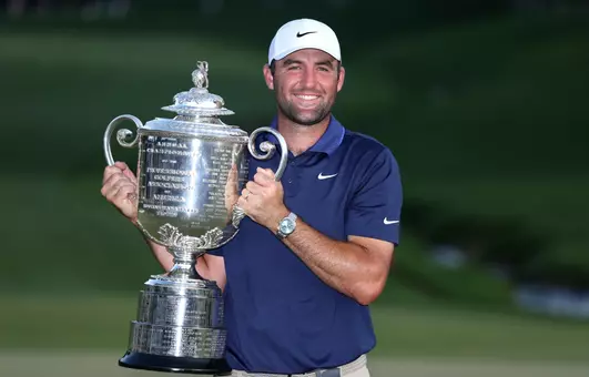 CHARLOTTE, NORTH CAROLINA - MAY 18: Scottie Scheffler of the United States poses with the Wanamaker Trophy after winning the 2025 PGA Championship at Quail Hollow Country Club on May 18, 2025 in Charlotte, North Carolina. (Photo by Warren Little/Getty Images)