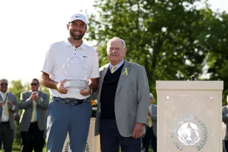 DUBLIN, OHIO - JUNE 01: Jack Nicklaus presents Scottie Scheffler of the United States with the trophy after Scheffler won the Memorial Tournament presented by Workday 2025 at Muirfield Village Golf Club on June 01, 2025 in Dublin, Ohio. (Photo by Michael Reaves/Getty Images)
