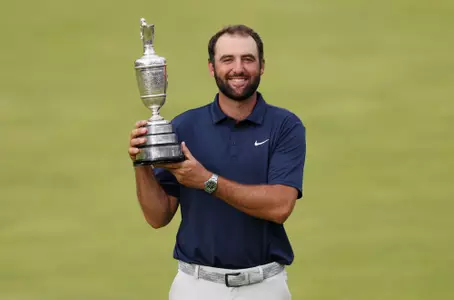 PORTRUSH, NORTHERN IRELAND - JULY 20: Scottie Scheffler of the United States poses with the Claret Jug on the 18th green after winning The 153rd Open Championship at Royal Portrush Golf Club on July 20, 2025 in Portrush, Northern Ireland. (Photo by Andrew Redington/Getty Images)