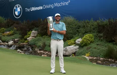 OWINGS MILLS, MARYLAND - AUGUST 17: Scottie Scheffler of the United States poses with the tournament trophy after his winning round on the 18th green after the final round of the BMW Championship 2025 at Caves Valley Golf Club on August 17, 2025 in Owings Mills, Maryland. (Photo by Andy Lyons/Getty Images)
