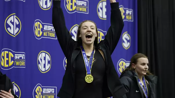 Jillian Cox cheering with excitement at the podium