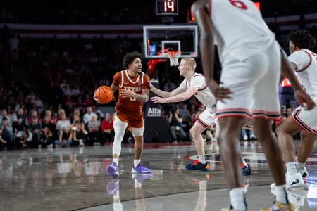 Jordan Pope dribbling at Georgia