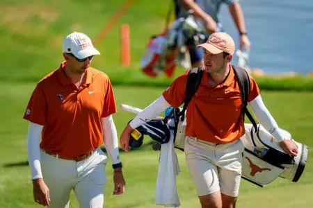 Eduardo Derbez Torres walks with Assistant Coach Clayton Brady