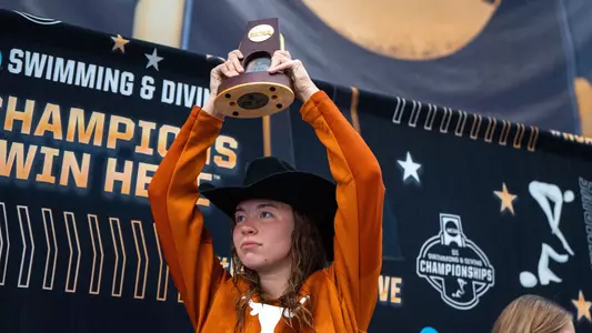 Jillian Cox hoisting her National title to the crowd