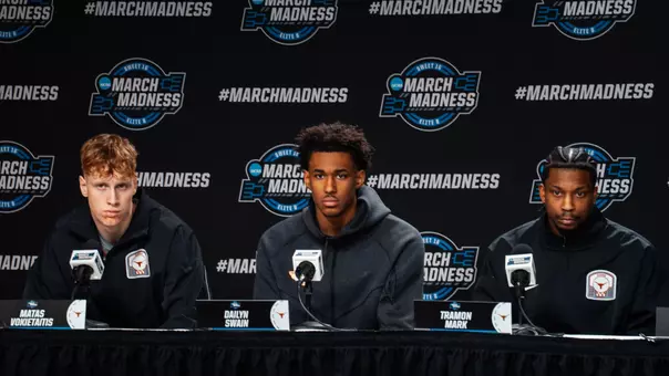 Men's Basketball pre-NCAA Sweet 16 player presser at podium