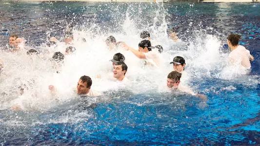 Texas Longhorn Men's Swimming and Diving team in the pool following their NCAA Championship Victory