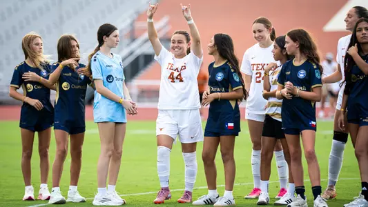 Amalia Villarreal Horns Up Pregame -- Texas A&M