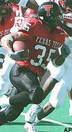 Texas Tech running<br>back Shaud Williams<br>rushes past Iowa<br>State defensive lineman<br>Reggie Hayward in<br>the first half Saturday.