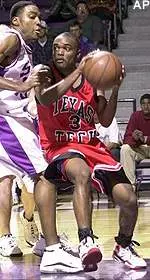 Rayford Young tries to work the ball inside on Stephen F. Austin's Emmaneul Jackson in the 80-56 Red Raider win Wednesday.