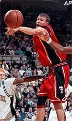 Andy Ellis knocks the<br>ball away from<br>Monte Hardge during<br>the first half.