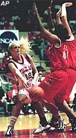 Texas Tech's Cara Gibbs<br>passes around N.C. State's<br>Talisha Scates during 85-78<br>Lady Raider win, Mon.
