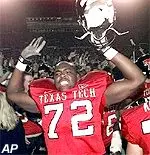 Nick Lee celebrates<br>with teammates after<br>Tech upset Texas.
