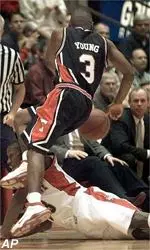Rayford Young chases a<BR>loose ball over Iowa State's Michael<BR>Nurse during the first half.