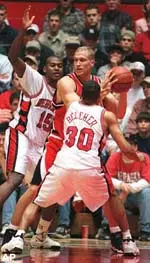 Tech's Rayford Young looks for an open<br>man while Nebraska's Chad Johnson and<br> Cookie Belcher apply pressure. The Raiders <br>fell to the Huskers 82-65 in Lincoln.