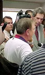 Football coach Spike Dykes<br>talks to the press.