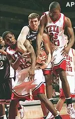 Texas Tech forward Jayson Mitchell (50) gets tangled up with Centenary forward Brien Rabenhorst while Tech's Johnny Phillips (25) tries to take the ball during Texas Tech's 51-41 victory Monday night.