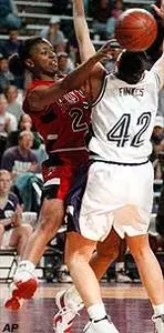Keitha Dickerson passes around Kansas State's Angie Finkes late in the first half of Tuesday's game.