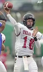 Kliff Kingsbury throws one of his four touchdown passes on Saturday, during the 45-39 victory over Kansas.
