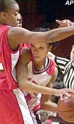 Katrisa O'Neal attempts to pass out of an NC State double team in the Lady Raiders 59-51 loss Saturday afternoon.