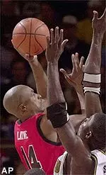 Mario Layne shoots for two over a Missouri defender in the first half of the 80-47 Tech loss Thursday in the Big 12 Tournament.