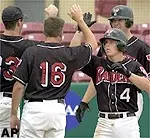 Texas Tech's Shaun Larkin (4) high-fives with teammates J.J. Newman (16) and Chad Reynolds (33) and Chaz Eiguren after hitting a three-run home run during the sixth inning of the NCAA Regional Saturday.