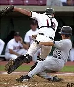 Texas Tech's Trey Lunsford looks to block the plate from Rice's Mitch Ackal in the third inning of Saturday's game.