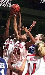 Texas Tech's Tanisha Ellison (34) and Dionne Brown (50) grab a rebound against Kansas State's Nicole Ohlde, back right, Wednesday.