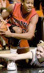 Texas Tech center Dionne Brown fights for a loose ball with Oklahoma State center Trisha Skibbe during the first half of the Lady Raiders' 67-55 victory Saturday afternoon.