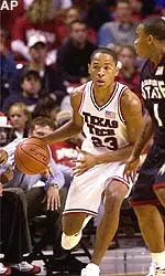 Texas Tech's Michael Marshall (23) dribbles around San Diego State's Deandre Moore (1) in the championship game of the Red Raider Classic.