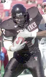 Texas Tech linebacker Jonathon Hawkins (47) returns an interception against Stephen F. Austin during the first half.