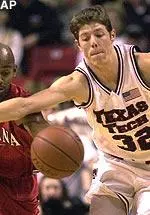 Louisiana-Lafayette guard Kenneth Lawrence fights for a loose ball with Texas Tech guard Nick Valdez (32) in the first half.